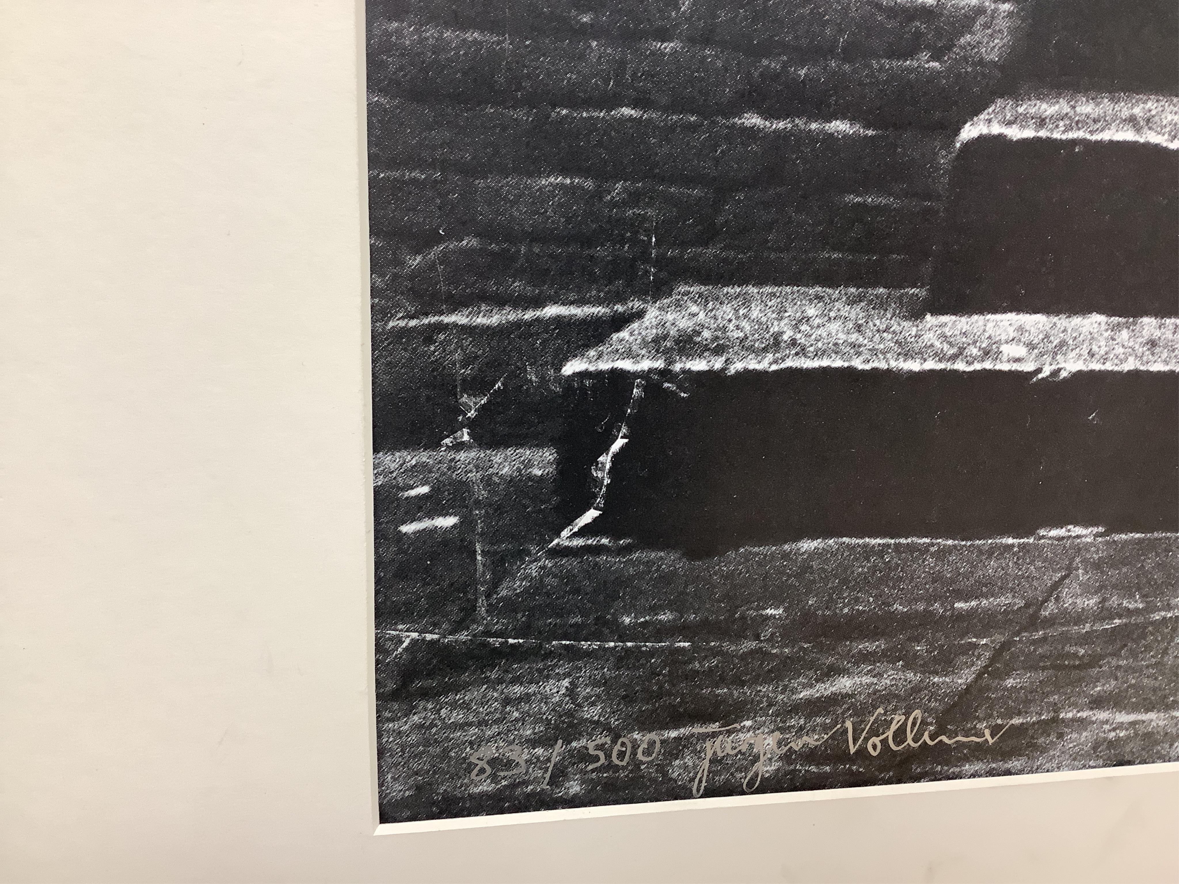 Jurgen Vollmer (German, b.1939), a framed signed limited edition lithograph 83/500 of John Lennon standing in a doorway in Hamburg (glass missing), 79 x 59cm